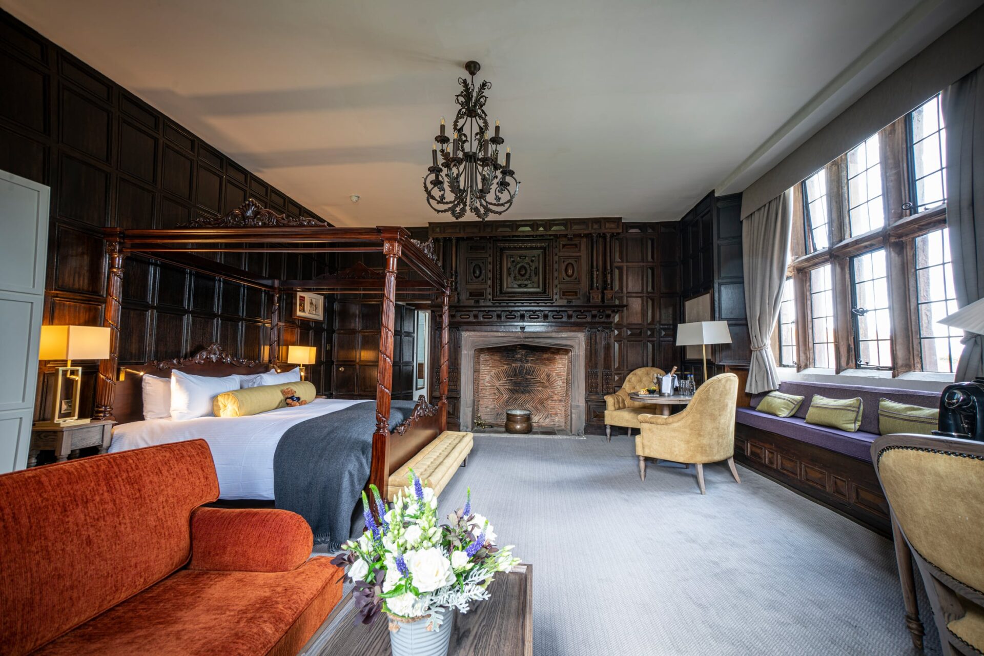 Bedroom With Four Poster Bed And Large Fireplace