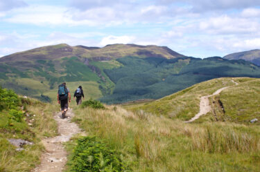 The,Back,Of,Some,Hikers,Along,The,West,Highland,Way