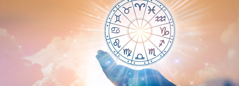 Zodiac signs inside of horoscope circle.