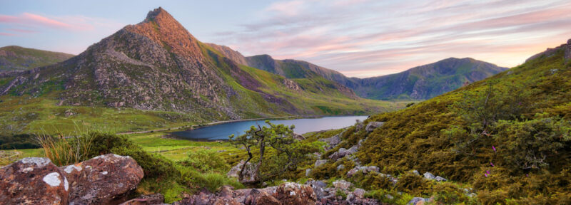 Rolling hills and a lake on a clear day in Snowdonia, Wales
