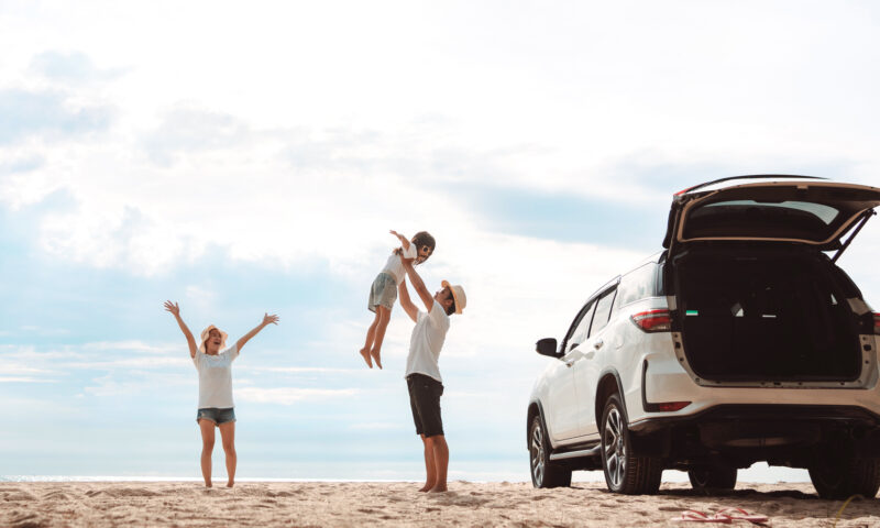 Happy Family with car travel road trip. summer vacation in car in the sunset, Dad, mom and daughter happy traveling enjoy together driving in holidays, people lifestyle ride by automobile.